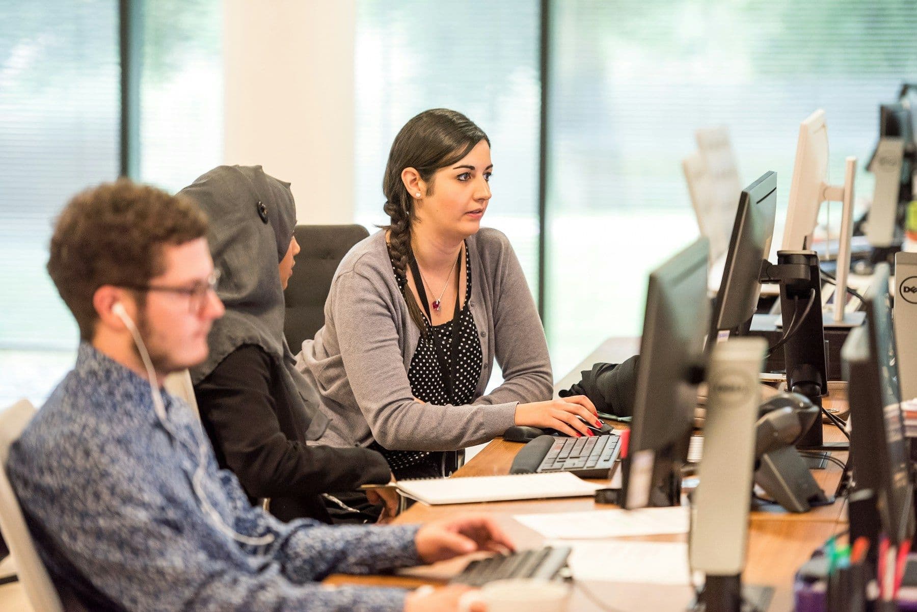 Team members collaborating in an office workspace